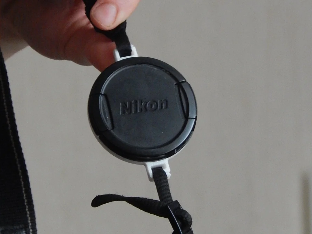 Держатель крышки объектива