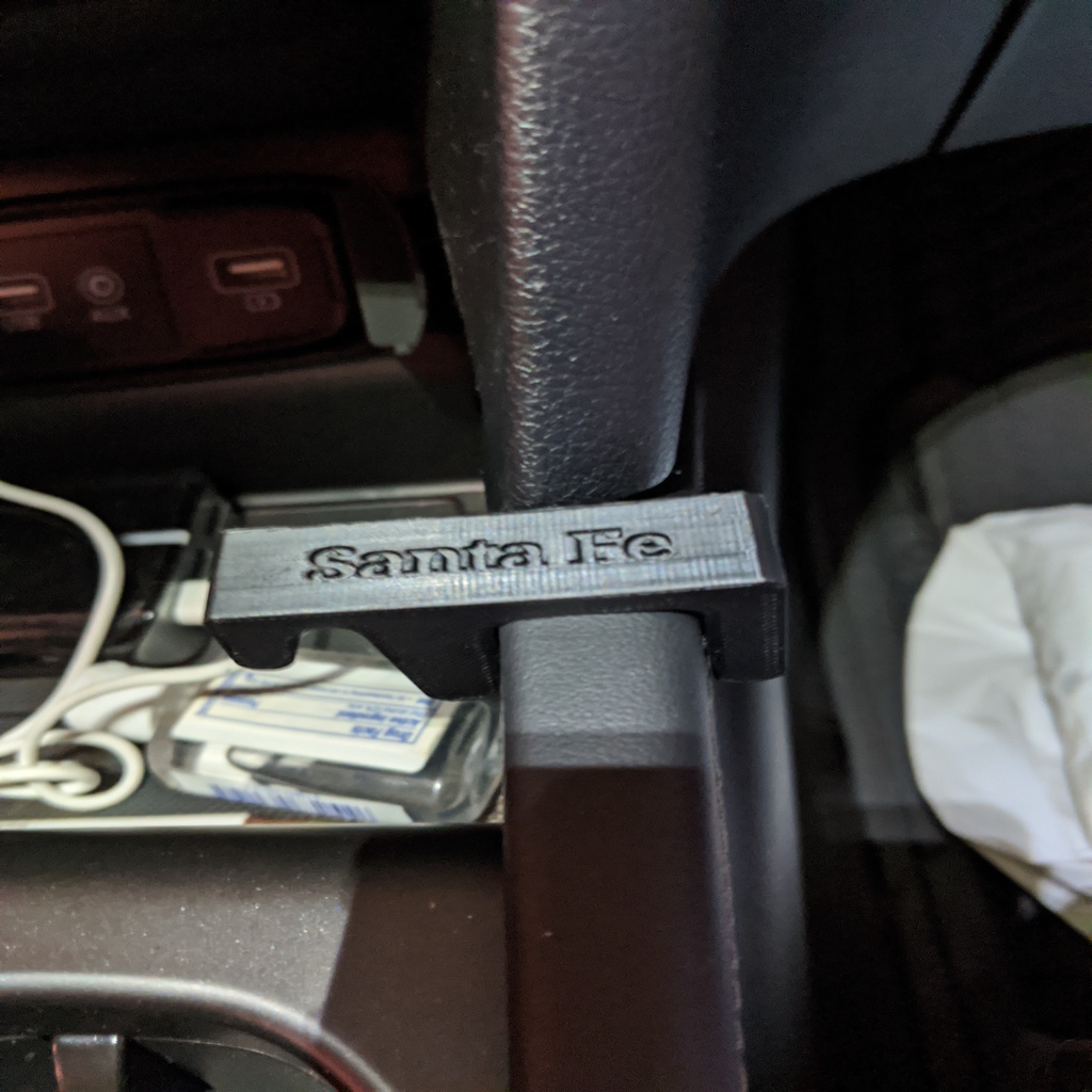 Клипса для мусорного пакета в Hyundai Santa Fe