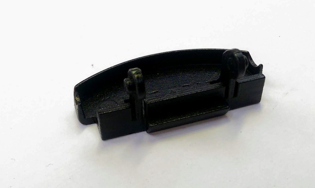 Зажим подлокотника центральной консоли